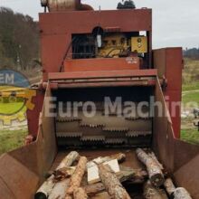 Large industrial wood chipper in great working condition from the front - infeed.