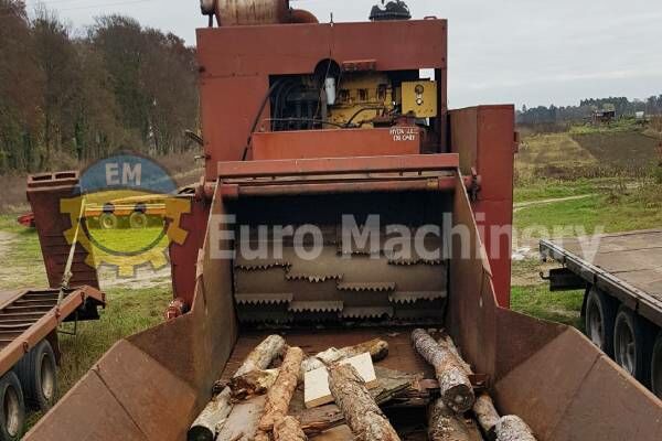 Large industrial wood chipper in great working condition from the front - infeed.