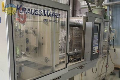 Injection molding machine from Krauss-Maffei for production of PP food containers.
